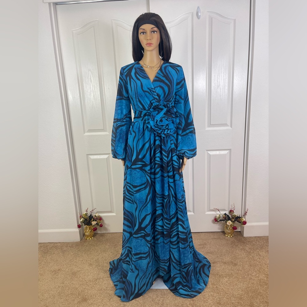 Vibrant Blue Patterned Wrap Maxi Dress with Flower Accent